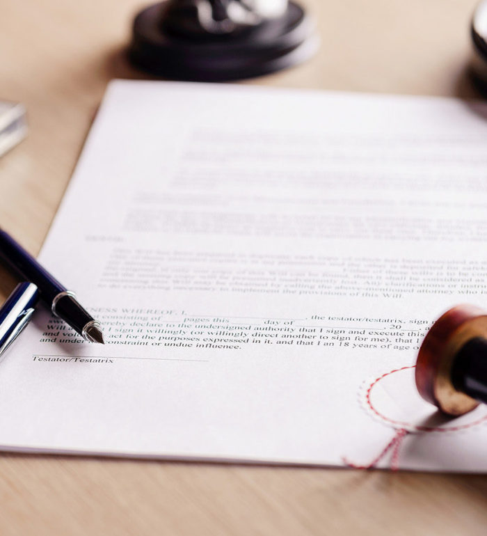 Notary pen lying on testament. Notary public working accesories
** Note: Shallow depth of field